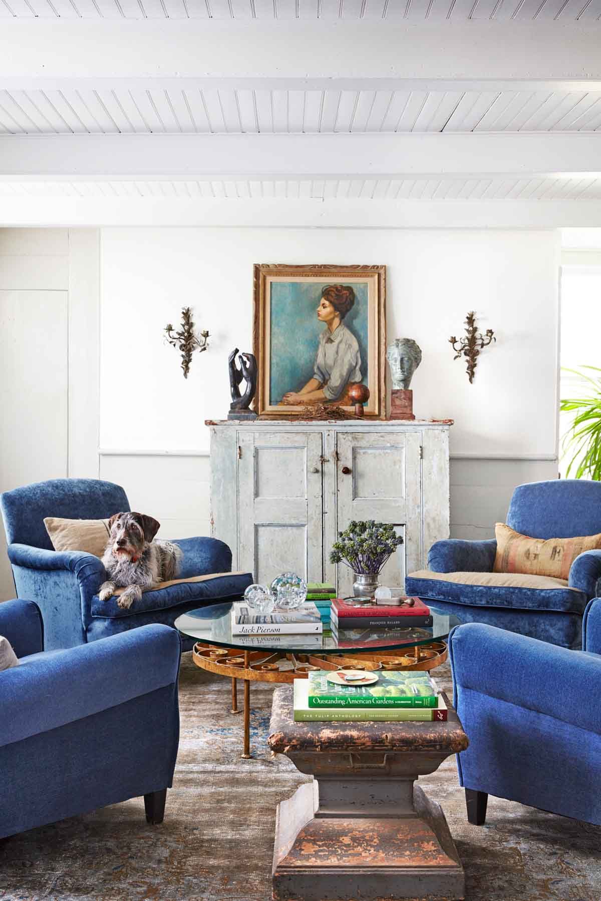 White living room with store blue sofa