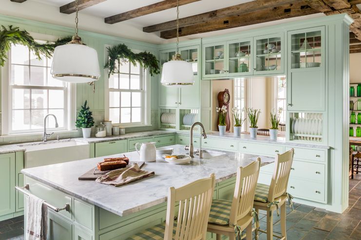 mint green kitchen cabinets with a gray marble countertop
