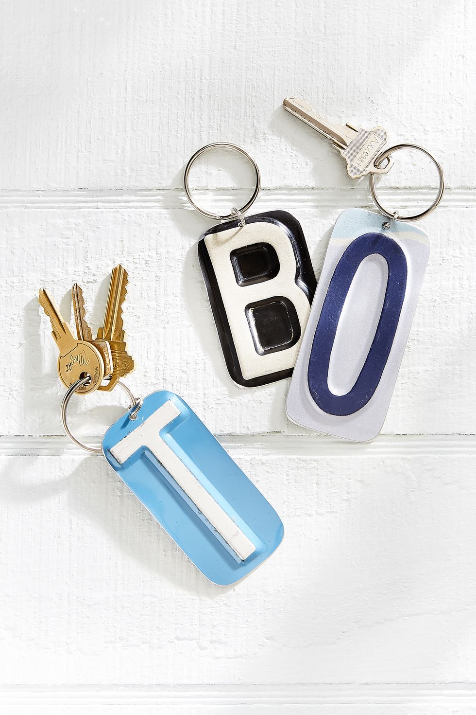 Electric blue, Metal, Material property, Keychain, Silver, Symbol, Everyday carry, Brass, 