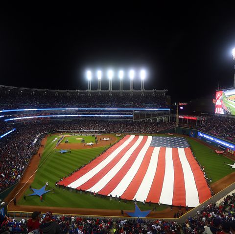 large american flag on baseball field
