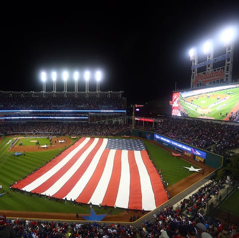 large american flag on baseball field