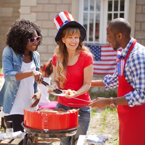 people around on a grill at a 4th of july barbecue