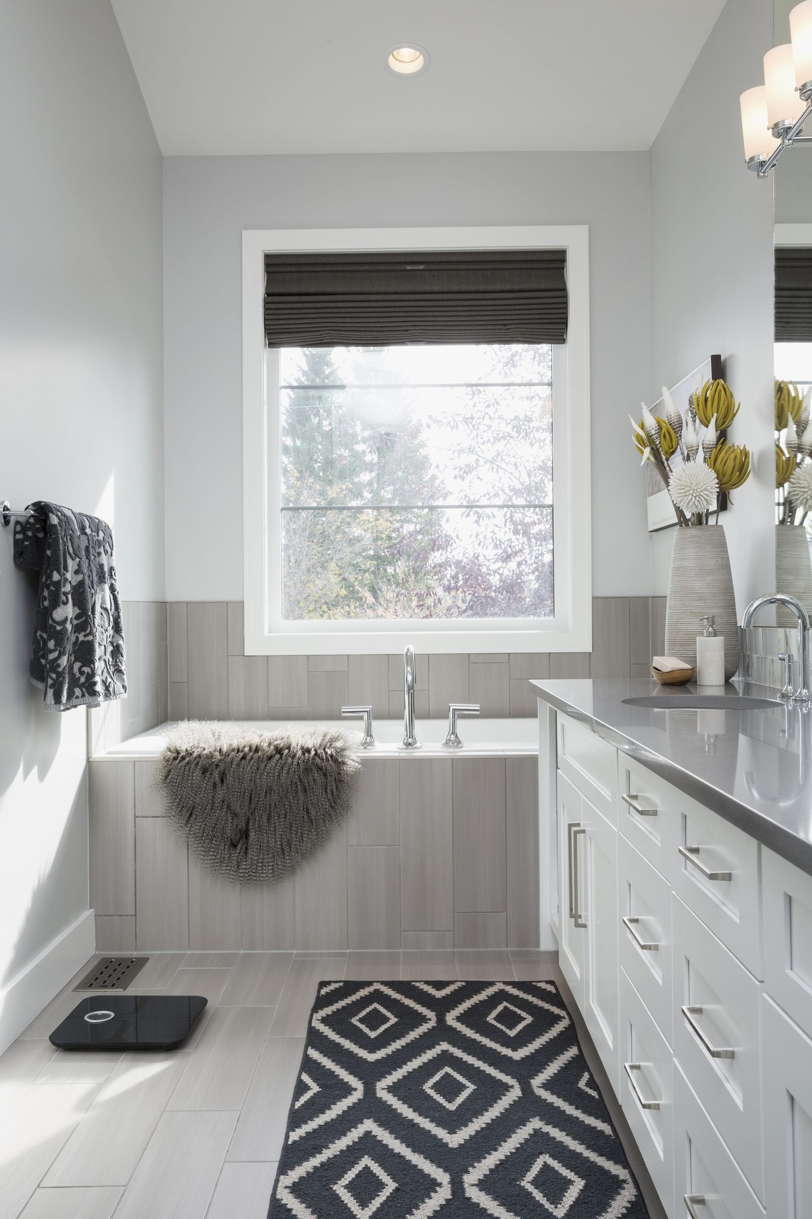 Gray walls in Fixer Upper bathroom by Joanna Gaines painted Kilz Wedding Band.