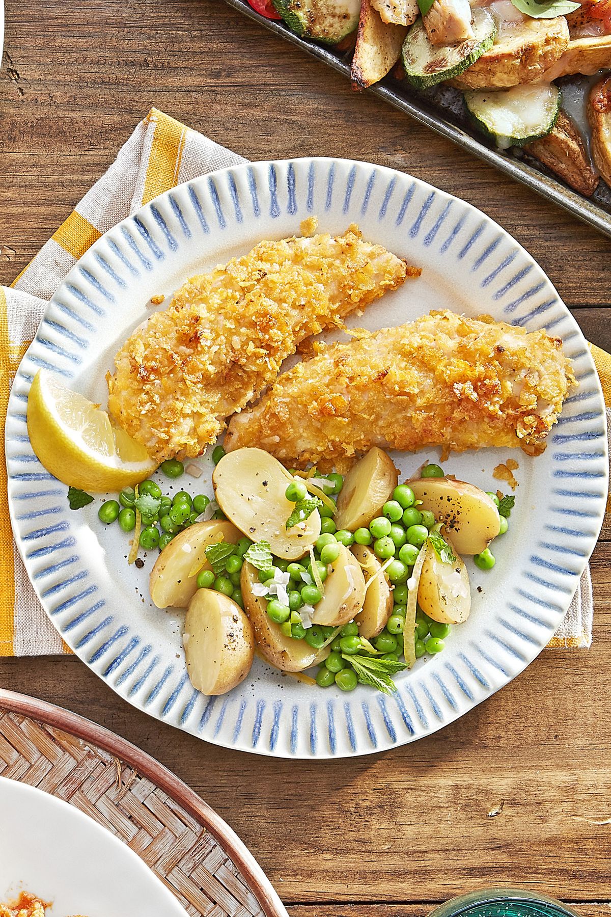 cornflake chicken tenders with potatoes and peas