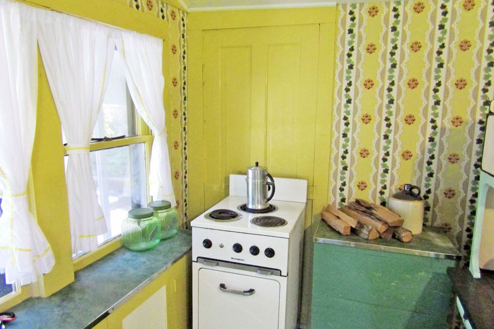Room, Property, Yellow, Curtain, Furniture, Interior design, Wall, House, Kitchen, Laundry room, 