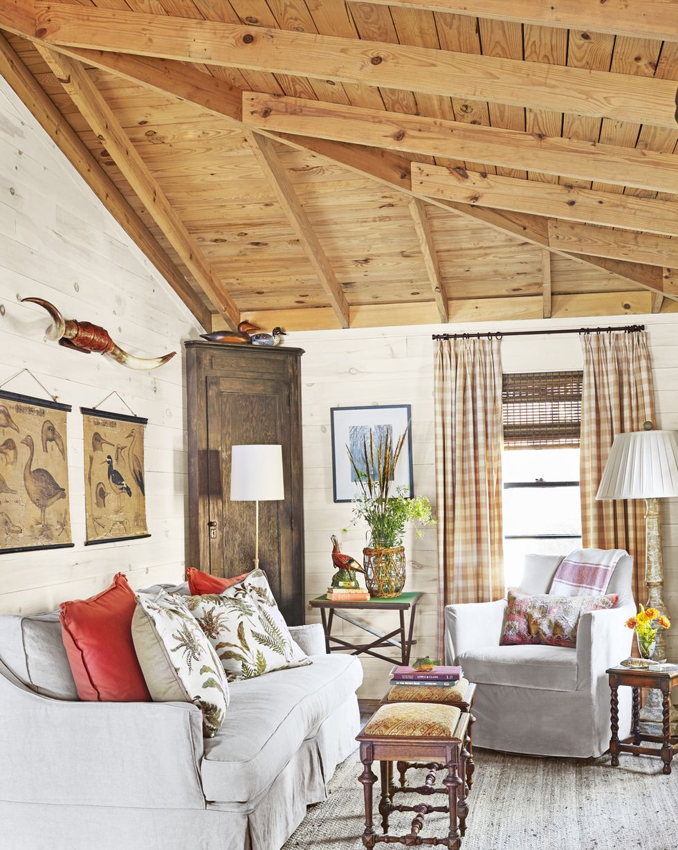 cabin living room with neutral upholstery and checked curtains