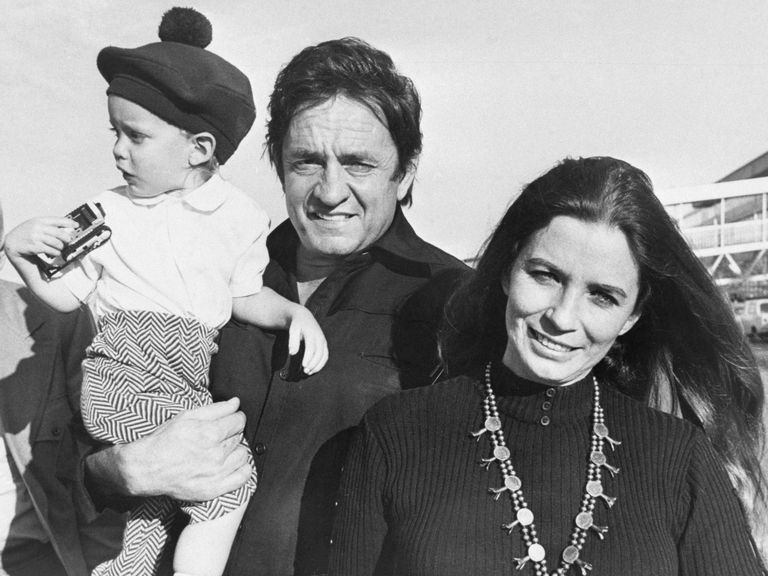 Johnny Cash and June Carter Cash with son in 1971