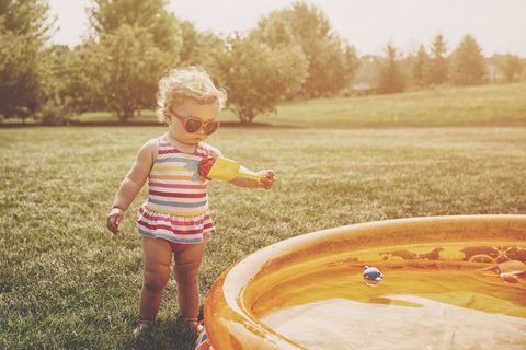 People in nature, Photograph, Child, Yellow, Water, Play, Toddler, Fun, Grass, Sunlight, 