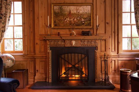 Hearth, Fireplace, Room, Furniture, Heat, Fire screen, Wood-burning stove, Interior design, Home, Building, 