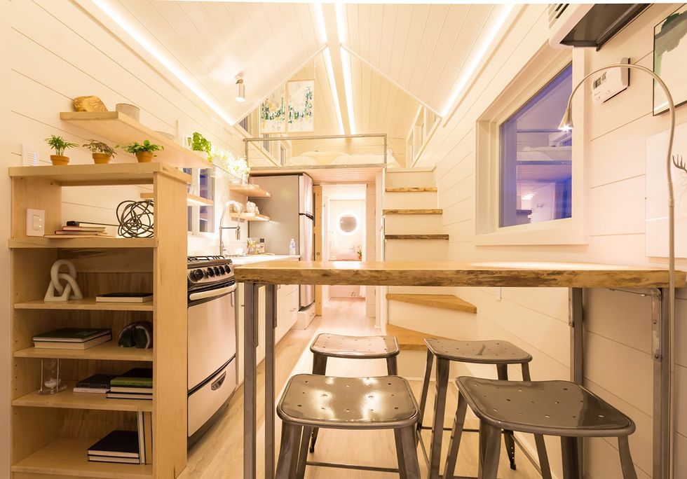 This Tiny Home Comes With a Greenhouse and Porch Swing
