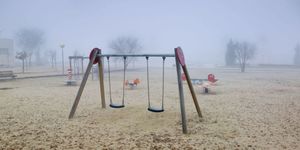 Swing, Outdoor play equipment, Playground, Public space, Atmospheric phenomenon, Human settlement, Recreation, Play, Fun, Playground slide, 