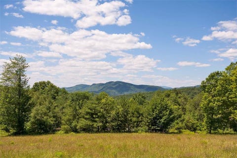 Natural landscape, Nature, Sky, Natural environment, Grassland, Vegetation, Tree, Cloud, Mountainous landforms, Nature reserve, 