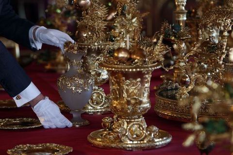 The dining table is set with silver-gilt pieces from the Grand Service