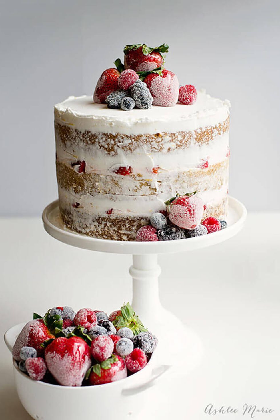 naked cake with candied and sugared berries