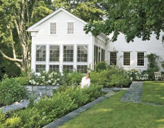 Restored Connecticut Home With White Garden and White Siding