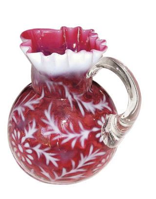 A pitcher in a Spanish lace pattern