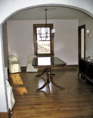 empty dining room with wood floor and table