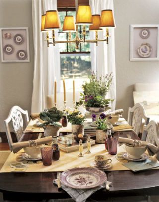 dark wood dining table with table settings and chandelier