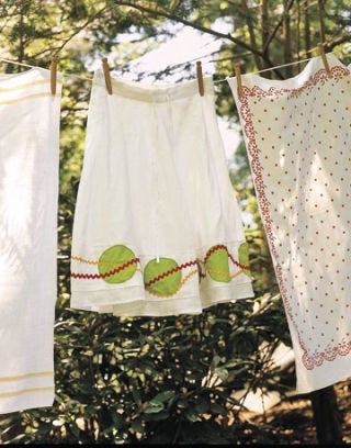 rickrack skirt and linens hanging from a clothes line
