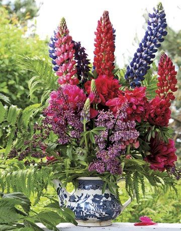 bright flowers in a teapot