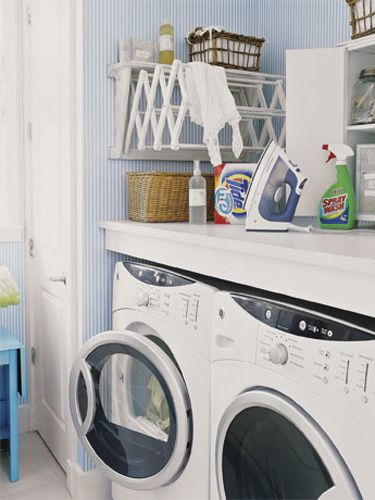 laundry room with expandable clothes rack