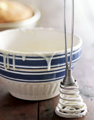 blue and white bowl with white icing dripping down the sides