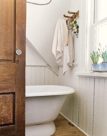 bathroom with white tub