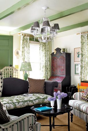 eclectic living room with patterned furniture and a chandelier