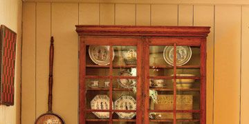 antique cupboard and plates