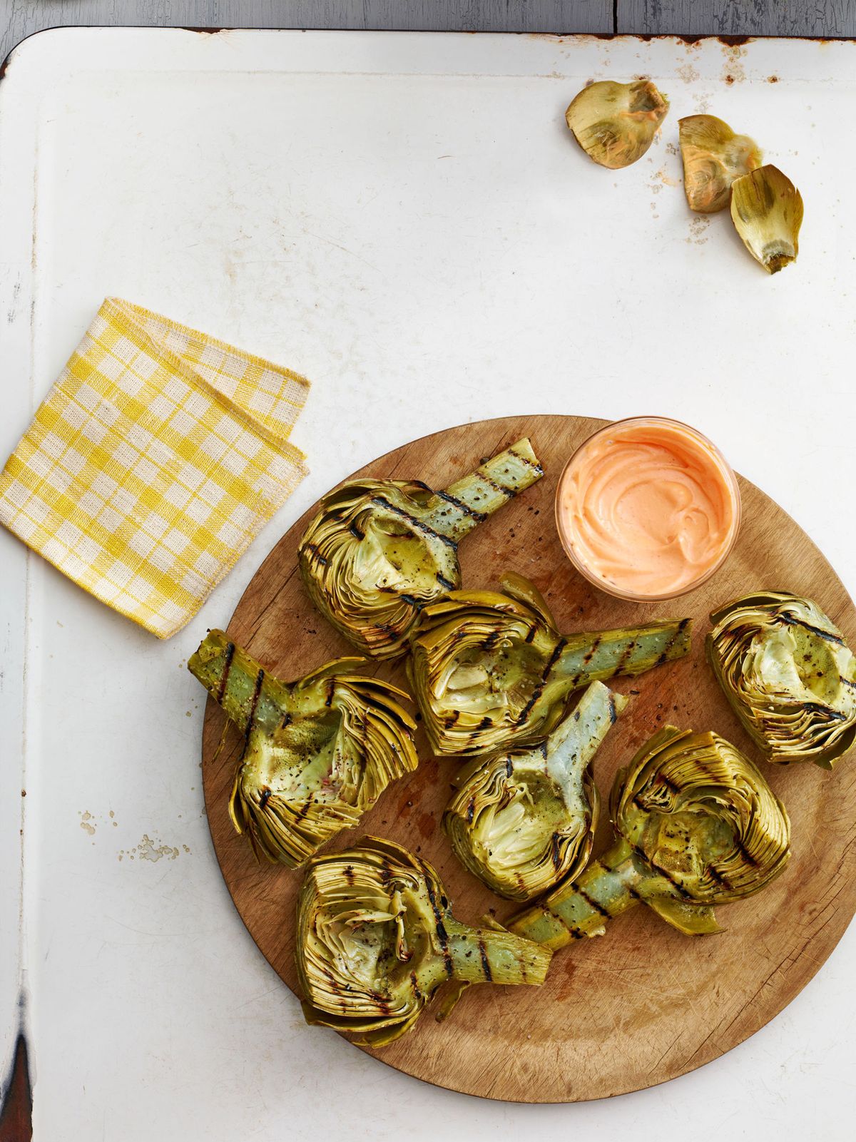 grilled artichokes with harissa honey dip