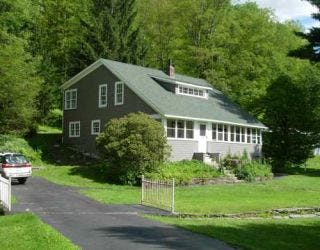 green and gray remodeled house for raised roof construction project