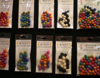 packages of colorful felt balls