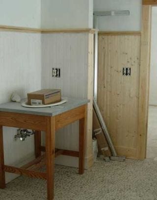 bathroom with ann sacks bali pebble stone flooring