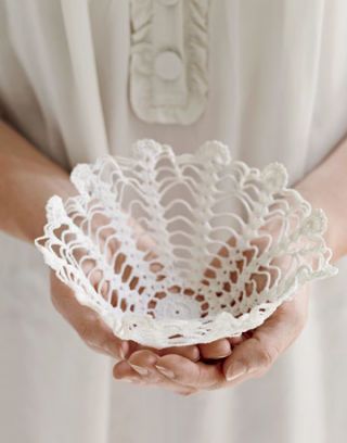 A liquid starch soaked lace doily, shaped into a bowl.