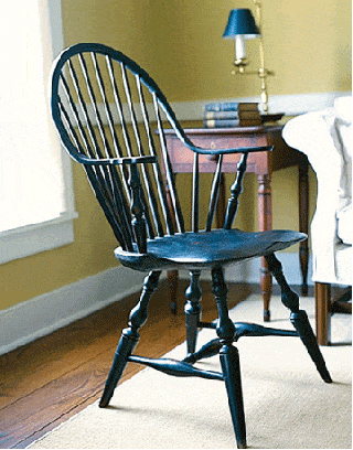 black wooden windsor chair in a bedroom