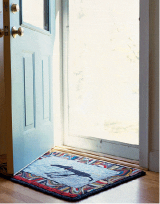 colorful doormat with patterned border and childs drawing of a dog