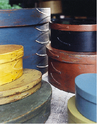 stacks of round shaker boxes of different sizes and colors