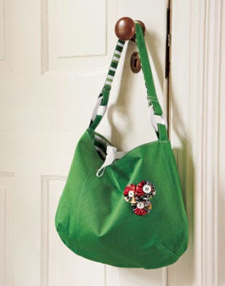 green purse with yo yos