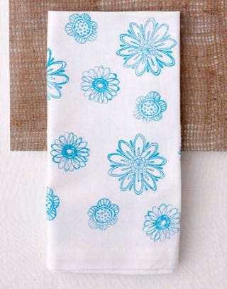 plant swap white napkin blue flowers