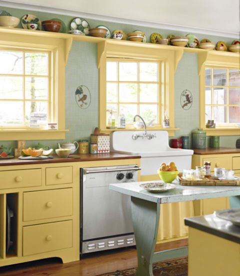 kitchen with green walls and yellow cabinets