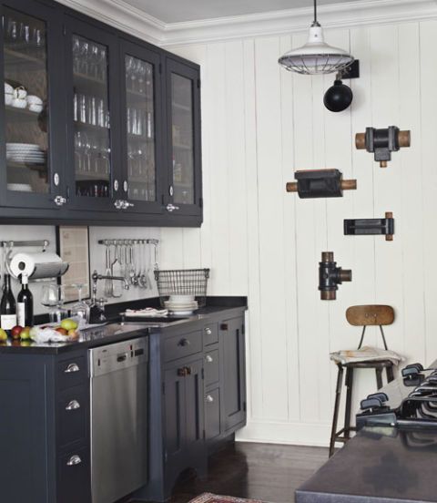 black cabinets in kitchen with white walls