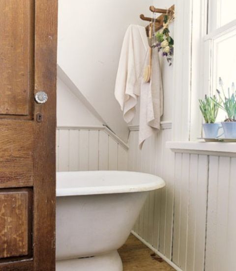 bathroom with white tub