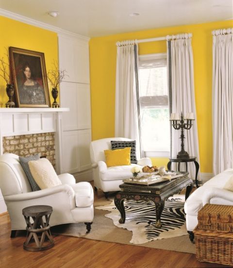 Living Room With Yellow Walls and Black and White Furniture
