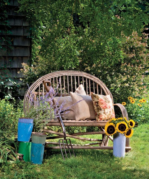 outdoor twig love seat with throw pillows
