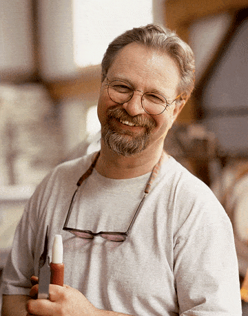 smiling man with glasses and beard