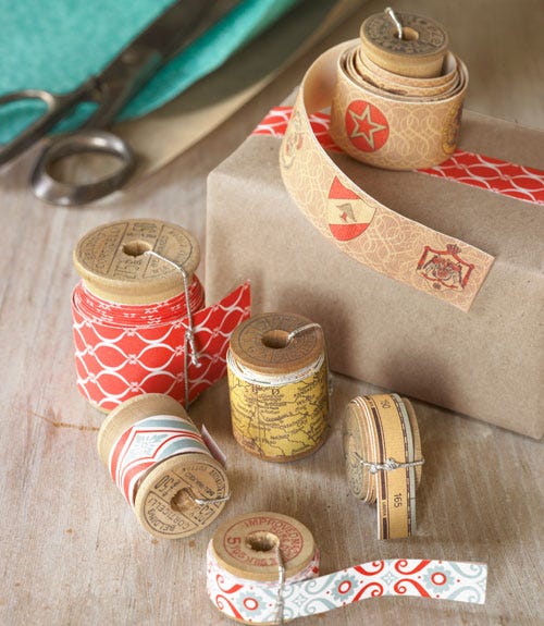 thread spools with paper wrapped around them