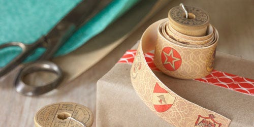 thread spools with paper wrapped around them
