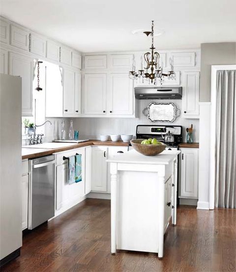 white kitchen with chandelier