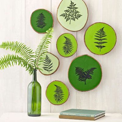 green fern silhouette plaques on a wall