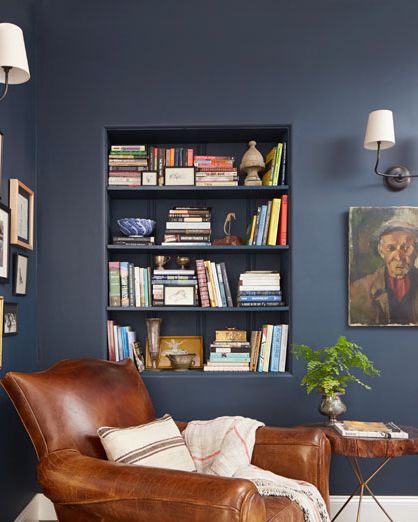 navy reading nook with leather club chair